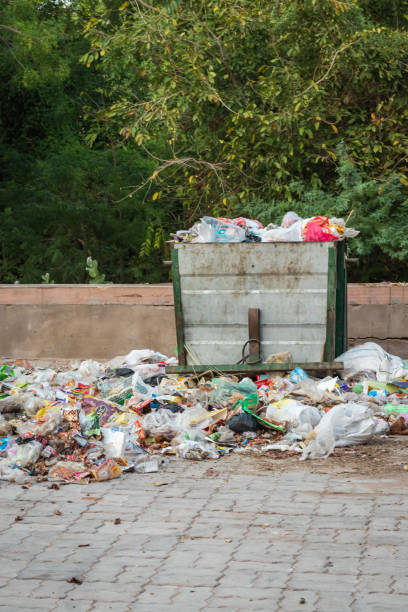 istock open garbage dust bin liter with plastic begs and waste items at day from different angle 1489051835