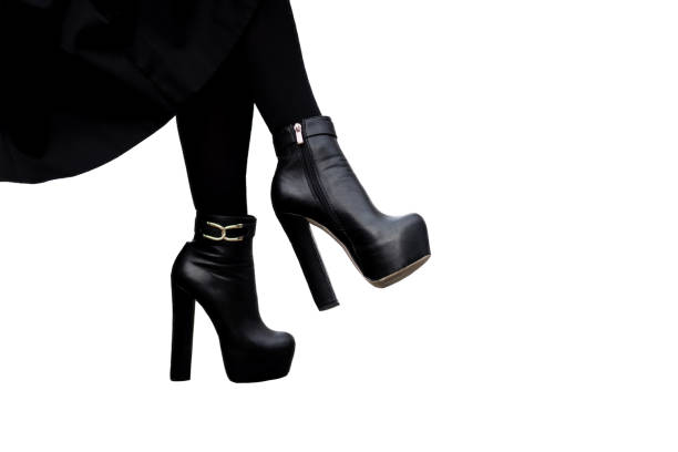 istock black high heeled boots isolated on a white background. 1489056111