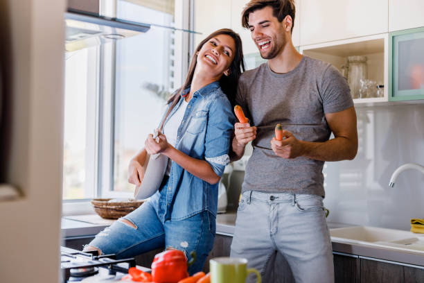 istock Cheerful couple having fun in the kitchen. 1489056187