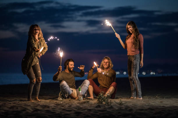 istock Night party on the beach with flaming torches! 1489057356