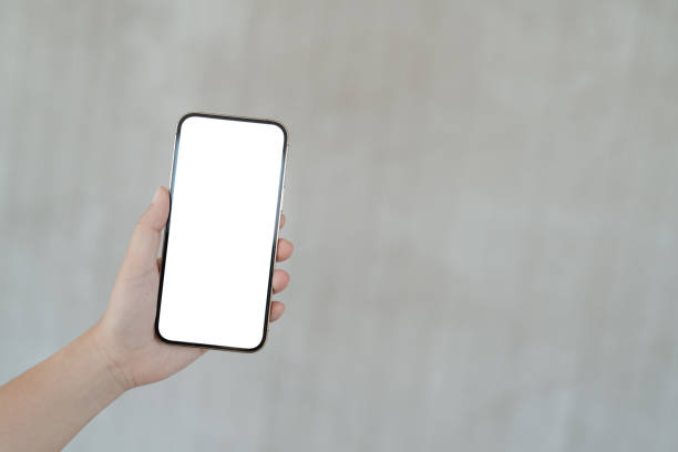 istock Women's hands holding cell telephone blank copy space screen. smartphone with blank white screen isolated. smart phone with technology concept. 1489057796