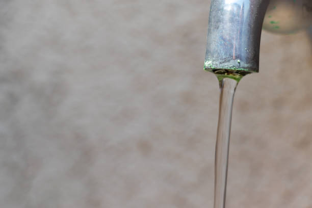 istock Water flowing from a metal tap 1489058195