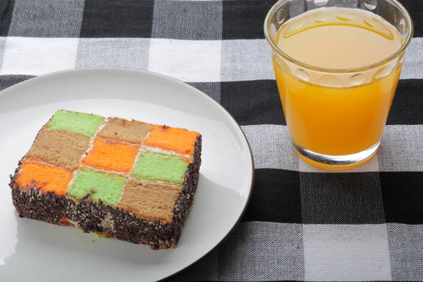 Selective focus on a chocolate cake and orange juice