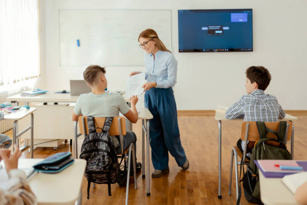 istock Female Teacher in Classroom 1489061671