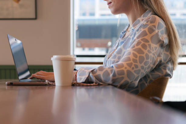 istock Young woman's hands typing on laptop 1489061858