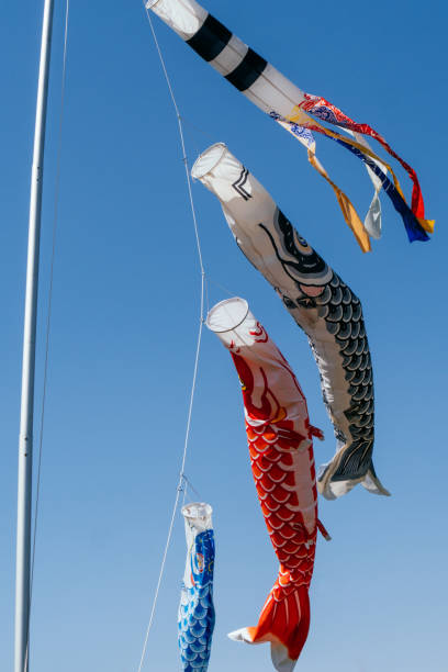 istock Image of carp streamers swimming in the blue sky 1489065409