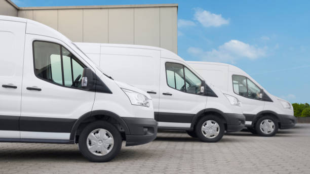 istock Three white vans in front of the distribution center 1489065412