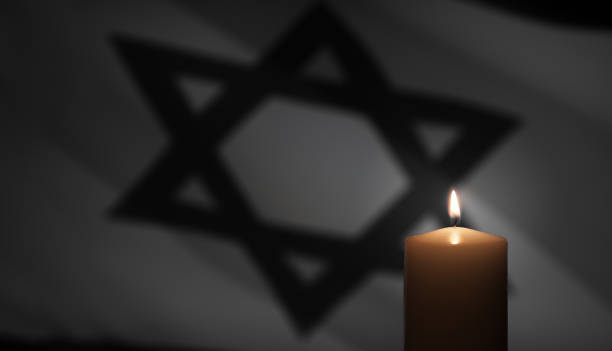 istock Burning candle on Israel flag background. 1489067705