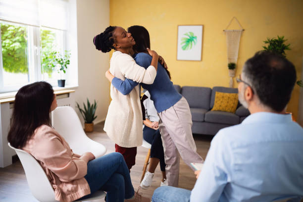 istock Multiracial women hugging during group therapy 1489069789