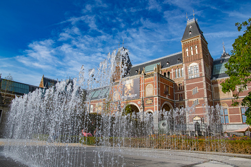 Amsterdam Architecture otuside the Rijksmuseum facades with a blue sky in the background during summer.