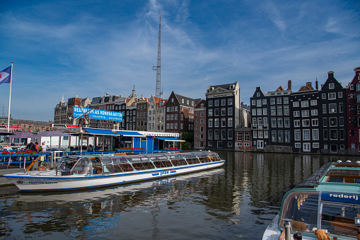 Scenery and architecture along the Amsterdan canal during a canal cruise
