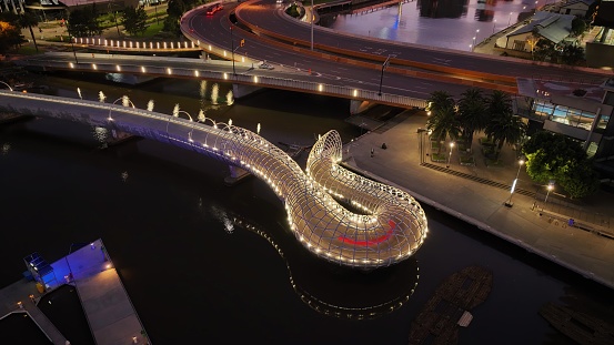 Melbourne, Australia – December 17, 2022: An aerial view of Webb Bridge in Melbourne, Australia, lit up brightly in the night sky
