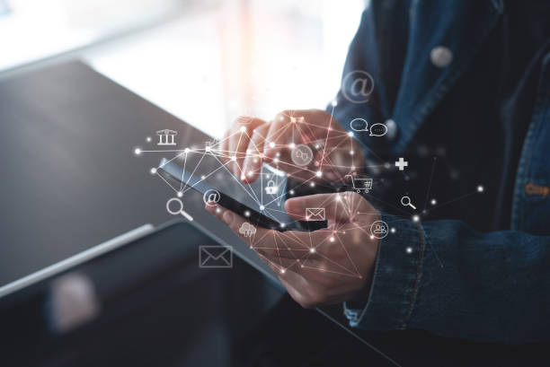 istock Internet of Things IoT, E-commerce concept. Woman using mobile phone with internet network connection via mobile apps, digital marketing, online shopping and mobile banking 1489071876