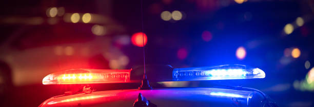 istock Police car with flashing lights on 1489073196
