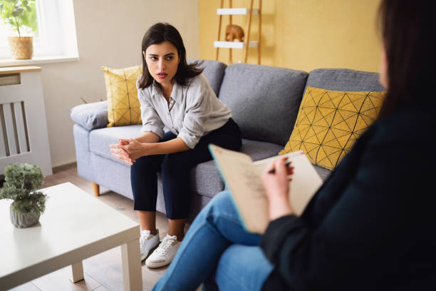 istock Young woman sharing her thoughts and emotion at the therapy 1489076209