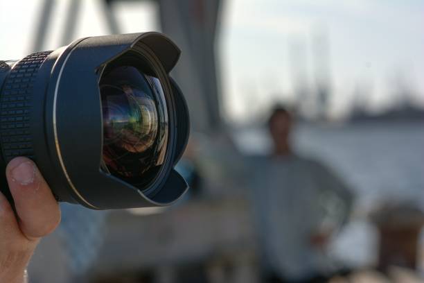 istock Closeup image of a professional video camera with a wide angle lens 1489077425
