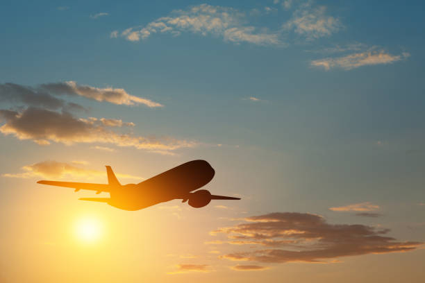istock Airplane taking off at the sunset sky. 1489077951