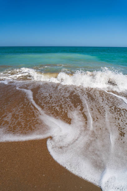 istock Sea surf on the beach of Spain in spring 1489078885