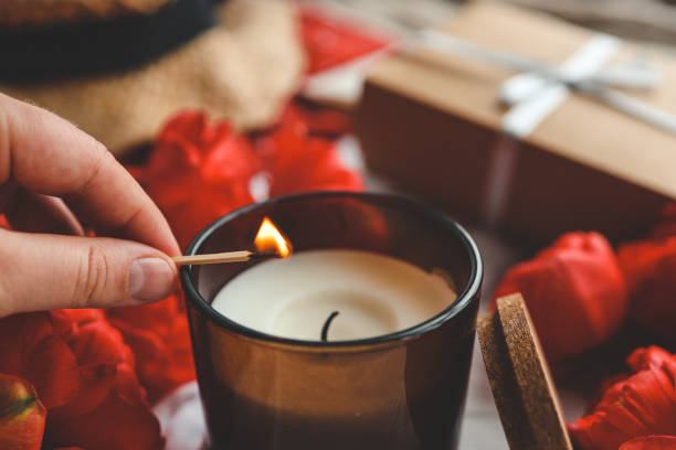 istock Match in hand lights a candle, atmospheric photo 1489082717