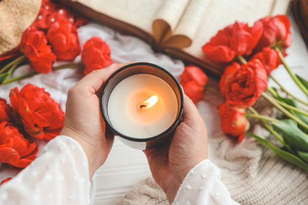 istock Burning candle in hands, aesthetics 1489082834
