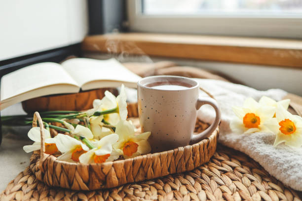 istock Cup of hot tea and spring home interior. good morning concept 1489083915