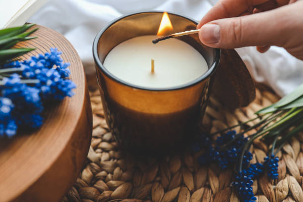 istock Match in hand lights a candle, atmospheric photo 1489084381