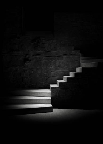 istock Black background. Stone stairs with abstract light. Steps in the darkness. 3D rendering 1489085368