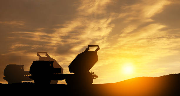 artillery rocket system are aimed to the sky at sunset. multiple launch rocket system. - mlrs imagens e fotografias de stock