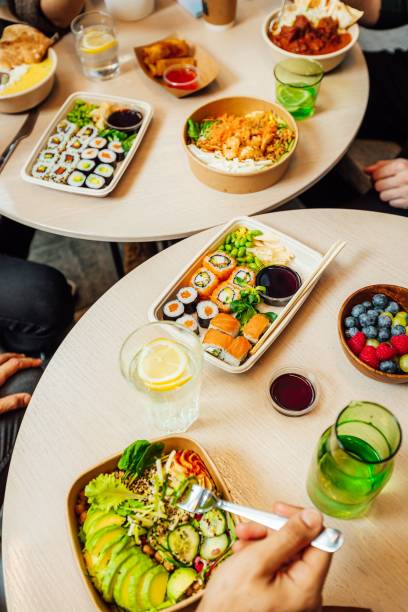 istock several people at a table with plates of food in each 1489088491