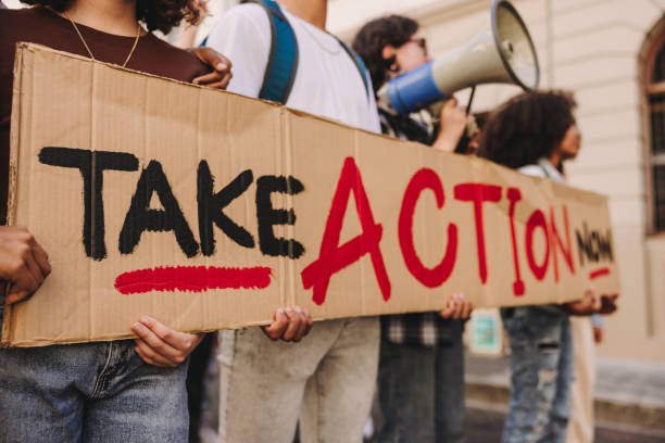 istock Young people protesting in the city 1489090626