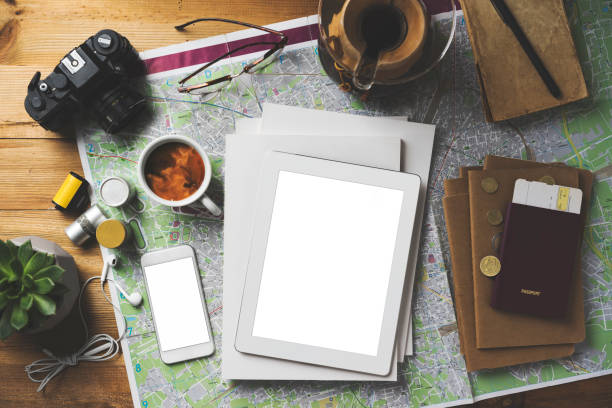 istock Travel concept flat lay, blank screen smart devices and white magazine 1489091054