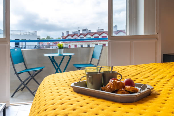 Breakfast in bed for two with red rose