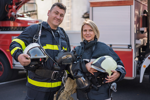 Firefighters posing and looking at camera