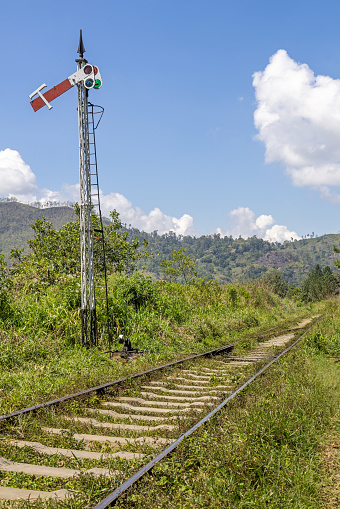 Single track railroad with a old fashioned signal just outside Ella in the Uva Province in Sri Lanka