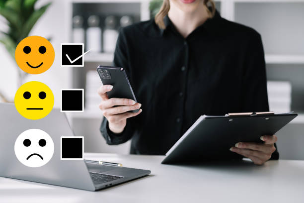 istock User give rating to service experience on online application smartphone. 1489097367
