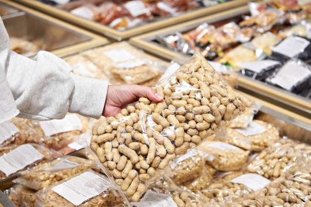 istock Buyer with peanuts in store 1489097434