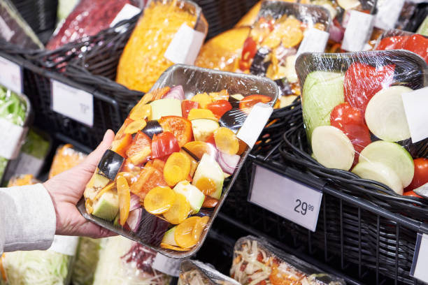 istock Fresh cut vegetables in hands of customer in store 1489097508