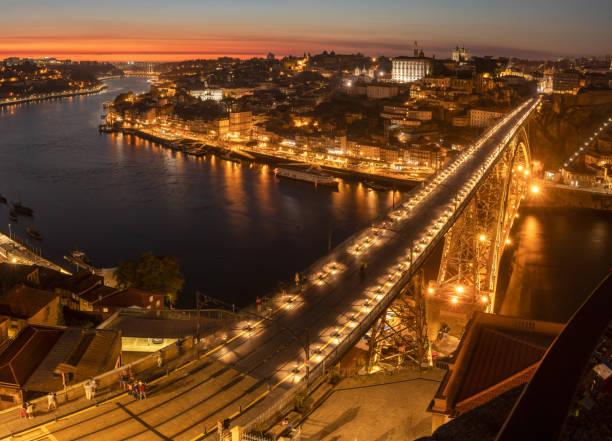 View over the D. Luís bridge and the city of Porto at dusk from the Serra do Pilar viewpoint in Vila Nova de Gaia, Portugal. stock photo