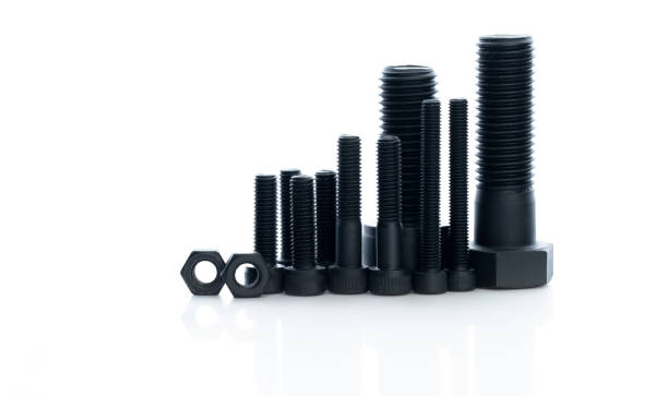istock Black bolts and nuts isolated on white background. Industrial fasteners. Hardware tools. Stud bolt, hex nuts, and hex head bolts. Threaded fastener use in automotive engineering. Metal fasteners. 1489100521