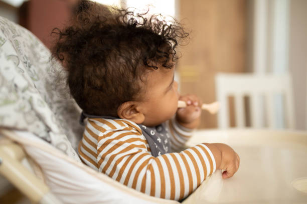 istock Baby boy in a high chair 1489103754