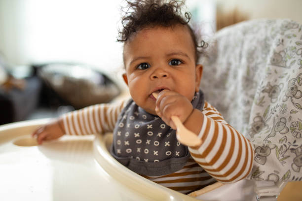istock Baby boy in a high chair 1489103762