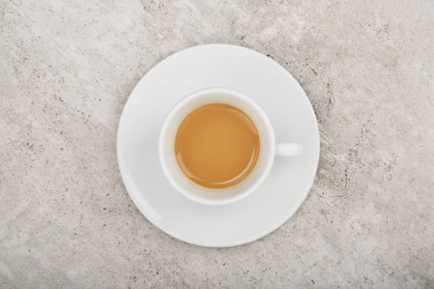 istock White cup of coffee from above on concrete cafe table 1489104057
