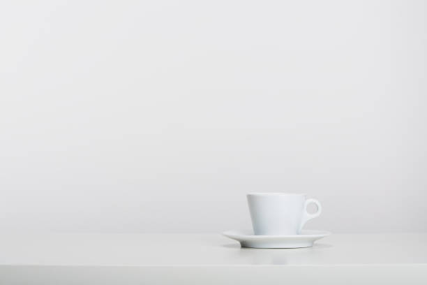 White porcelain mic espresso coffee cup with saucer on white background, soft shadow