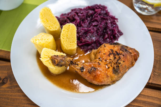 istock Chicken thigh, stewed red cabbage and potato dumpling. 1489105876