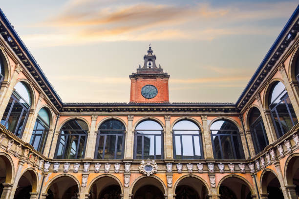 istock Bologna, Italy Biblioteca Comunale dell'Archiginnasio courtyard with clock tower against sky. 1489109709