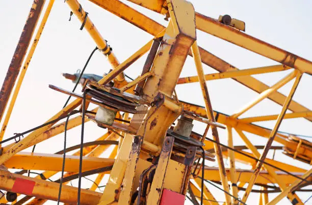 part of a yellow folded construction crane