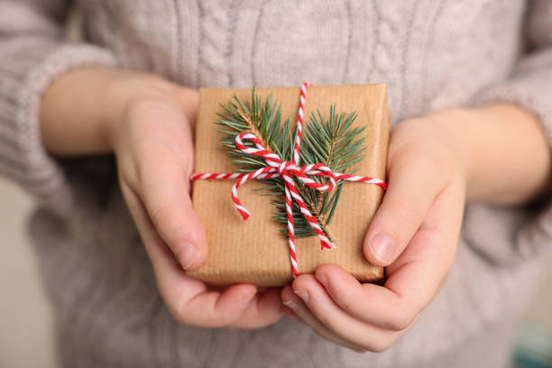 istock Little child holding decorated box, closeup. Christmas gift 1489111933