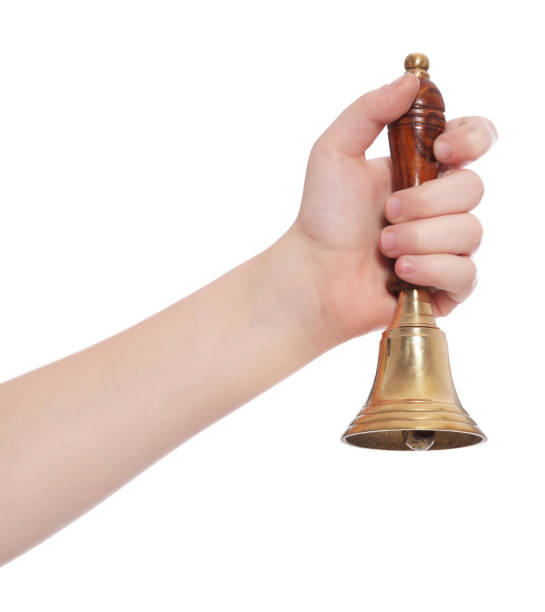 istock Pupil with school bell on white background, closeup 1489112025