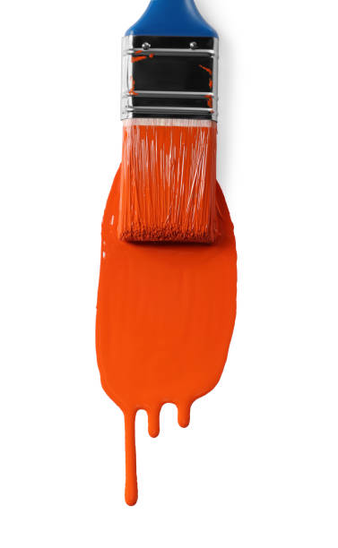 istock Brush with orange paint on white background 1489112109