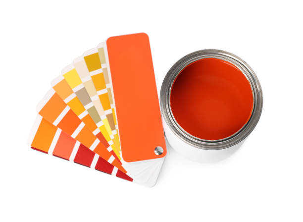 istock Can with orange paint and palette samples on white background, above view 1489112131